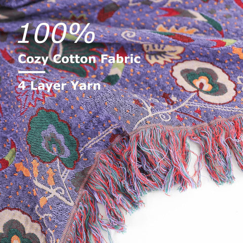 Close-up of purple boho cotton throw blanket showing intricate floral pattern and soft texture