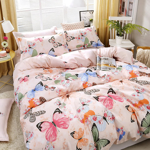 Butterfly bedding set with colorful print on queen size bed