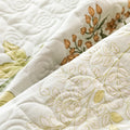 Elegant quilted texture with orange flower print and cotton fabric