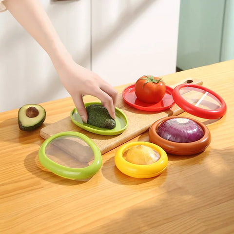 Person placing produce in colorful food saver pods