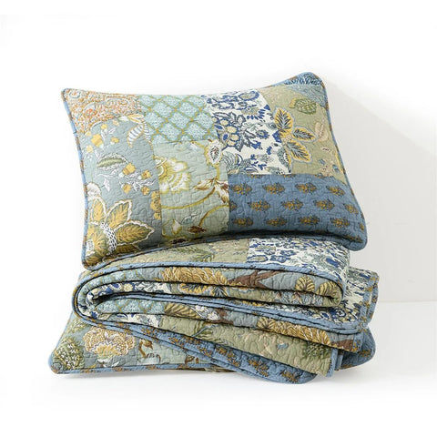 Laid-out view of reversible bohemian cotton quilt showing pattern mix