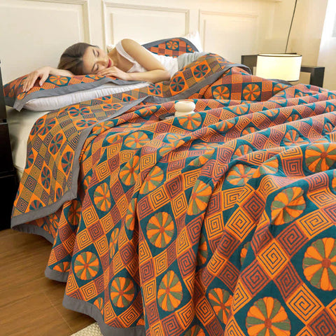 Woman relaxing on reversible Japanese quilt with geometric pattern
