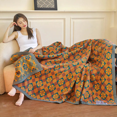 Japanese-style reversible quilt on wooden floor with blue tones