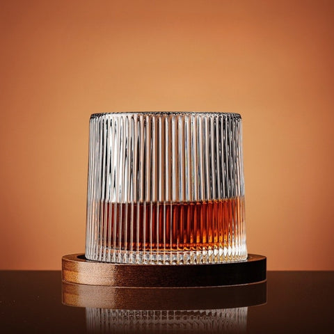 Glass with a wooden base on an orange background