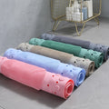 Rolled shower mats in five colors: pink, green, gray, blue, purple

