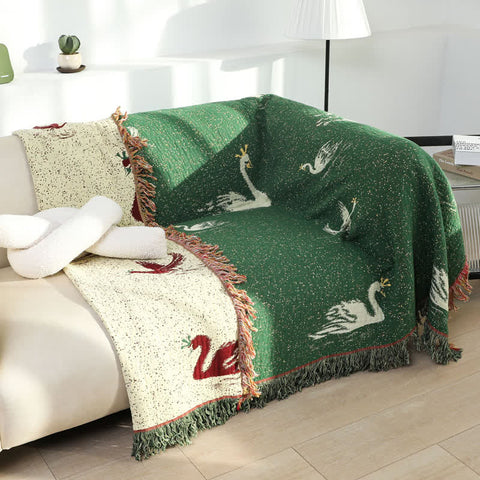 Reversible swan blanket styled as a couch cover in bright living room