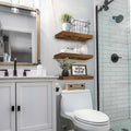 Modern bathroom setup with rustic shelves above toilet area