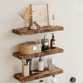 Rustic floating wall shelves styled with minimal home decor in bathroom