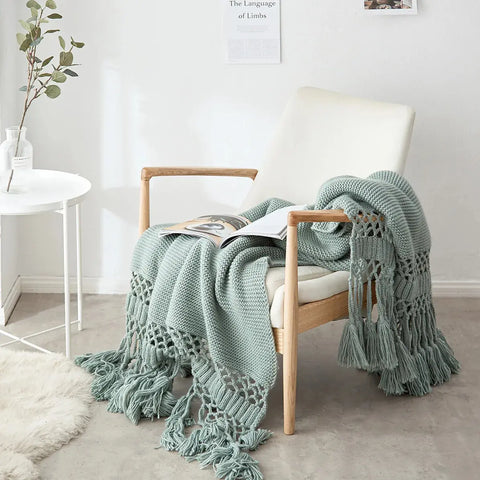 Sage Green Handmade Nordic Knit Tassel Blanket on modern chair – Scandinavian décor
