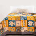 Close-up of Sahara Patchwork Cotton Throw showcasing vibrant tribal patterns and detailed stitching