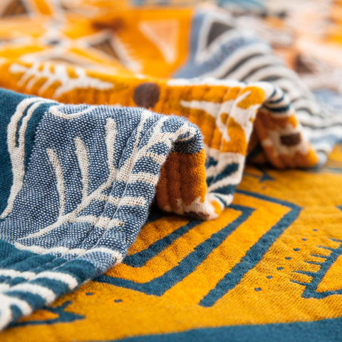 Detailed close-up of Sahara Patchwork Cotton Throw showing textured stitching and vibrant tribal-inspired pattern