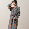 Woman wearing floral cotton gauze kimono robe