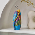 Seated resin sculpture for home decor shelves or living room styling

