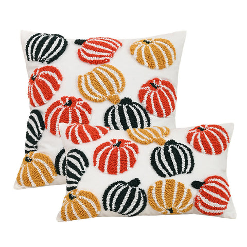 Set of festive tufted throw pillows and cushion covers with pumpkins in orange, yellow, and green