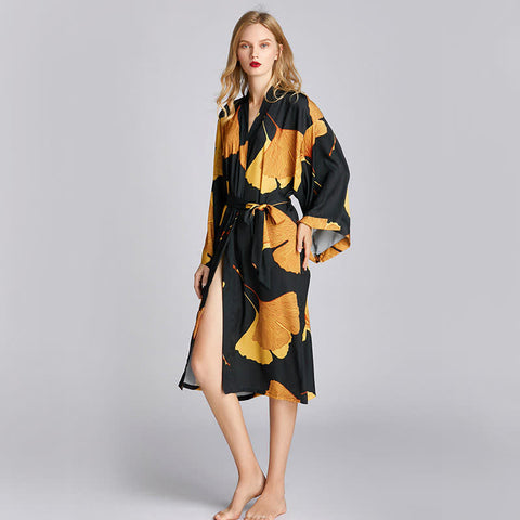 Silk-style black robe with golden ginkgo leaf pattern, belted waist, and wide long sleeves—premium lightweight loungewear for home, spa, or travel.