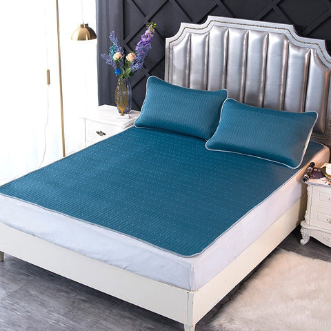Smoke blue latex cooling bed mat with pillowcases on silver modern bed