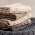 Soft honeycomb towels in beige, brown, and gray colors