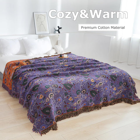 Floral patterned blanket draped over a bed in a bright bedroom with 'Cozy & Warm' text above. Purple boho throw bedroom
