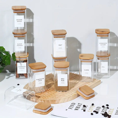 Elegant collection of labeled spice jars with eco-friendly bamboo tops displayed in rows.

