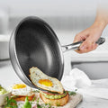 Stainless steel non-stick frying pan with egg and toast