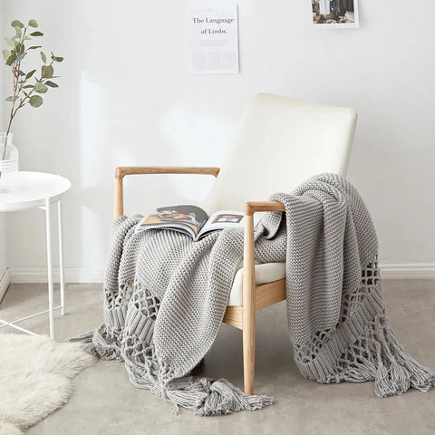 Stone Gray Nordic Knit Tassel Blanket on chair – premium Scandinavian sofa throw