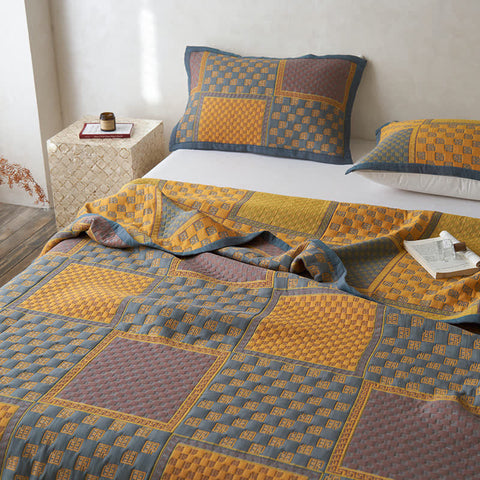 Stylish cotton bedding with bold retro block pattern and pillows