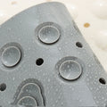 Close-up of waterproof suction cups on shower mat