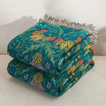  Folded Sunset Forest cotton blanket with colorful floral pattern