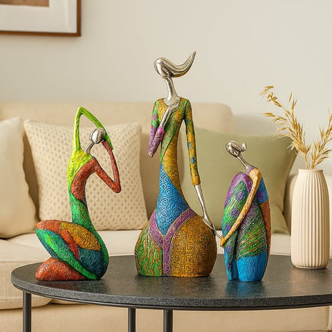 Colorful decorative statues on a table with a neutral background