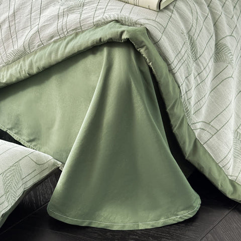 Close-up of triple-layer gauze cotton quilt with sage green backing