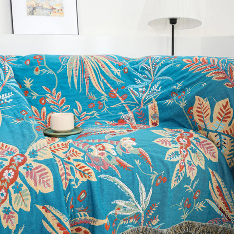 Tropical floral reversible cotton throw blanket used as a couch cover