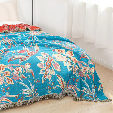 Cotton jacquard tropical floral throw blanket reversible design shown from side