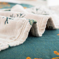 Close-up of a folded fabric with floral patterns on a textured surface