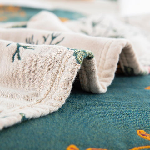 Close-up of a folded fabric with floral patterns on a textured surface