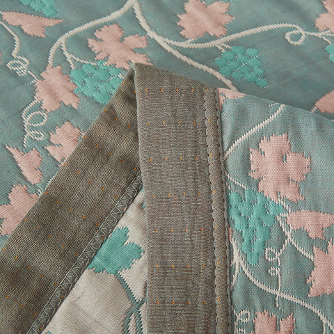 Close-up of vine leaf stitching and durable cotton edging
