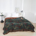 Vintage Boho cotton throw blanket spread on bed, showcasing cozy bedroom decor.
