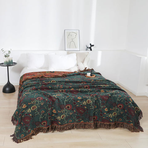 Vintage Boho cotton throw blanket spread on bed, showcasing cozy bedroom decor.