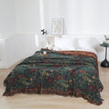 Another angle of vintage boho cotton throw blanket on bed, highlighting fabric texture and style.