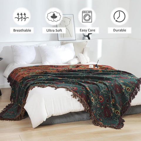 Vintage boho cotton throw blanket draped over a bed showing soft, breathable, easy care, and durable features in a bright bedroom setting with white pillows