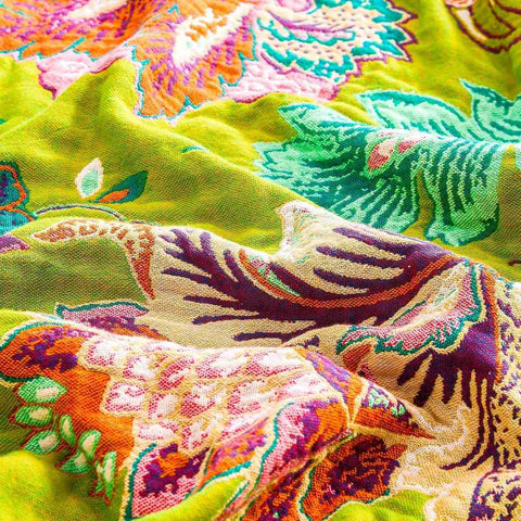 Close-up detail of Vintage Garden Cotton Throw Blanket showcasing vibrant floral and leaf patterns in warm autumn colors