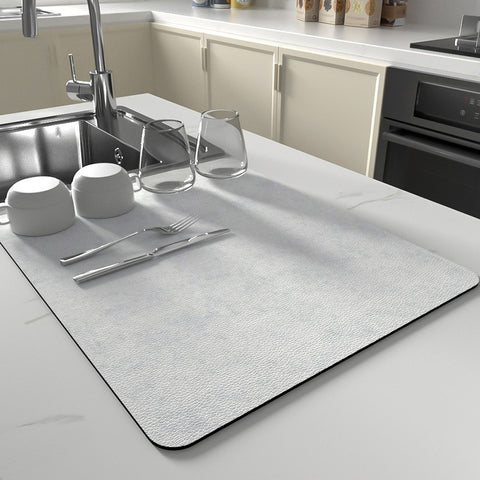 White quick-dry kitchen dish mat with dishes on marble counter