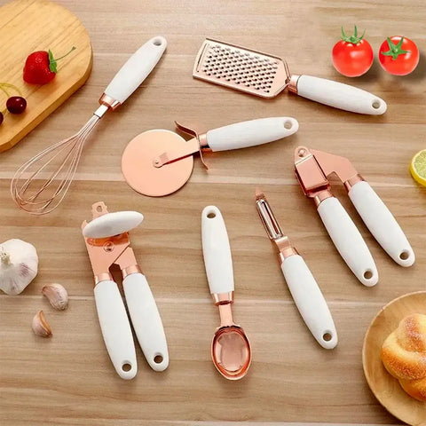Stylish 7-piece cooking utensil set with rose gold finish and non-slip white handles. Adds durability and elegance to your kitchen tools.