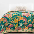 Close-up of Wildflower Grove Cotton Throw Blanket floral pattern and texture on bed