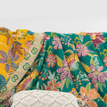 Close-up of floral pattern and decorative edge on Wildflower Grove Cotton Throw Blanket