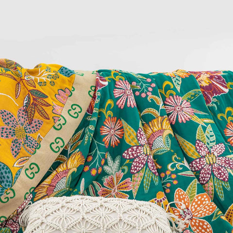 Close-up of floral pattern and decorative edge on Wildflower Grove Cotton Throw Blanket