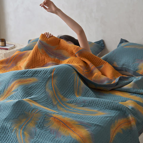 Woman waking up under soft feather quilt in modern bedroom
