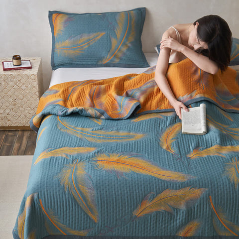Woman waking up under soft feather quilt in modern bedroom