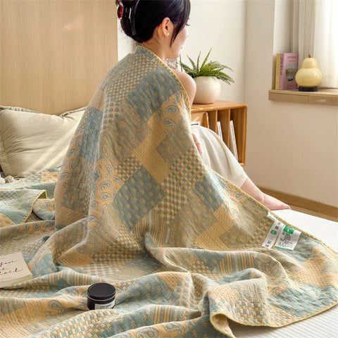 Woman wrapped in breathable cotton quilt with vintage pattern