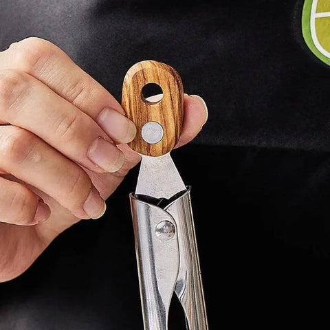 Close-up of locking system on wooden handle tongs