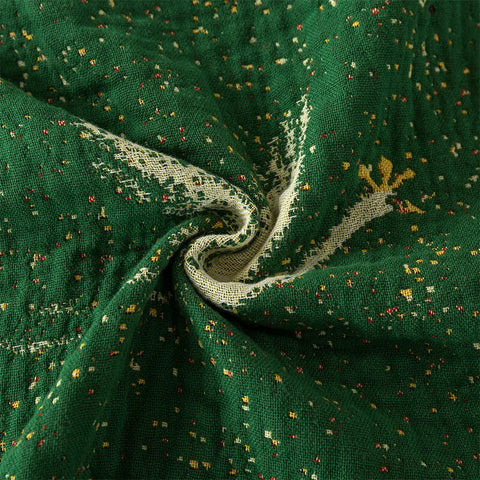 Twisted view showing texture of breathable cotton green woven blanket